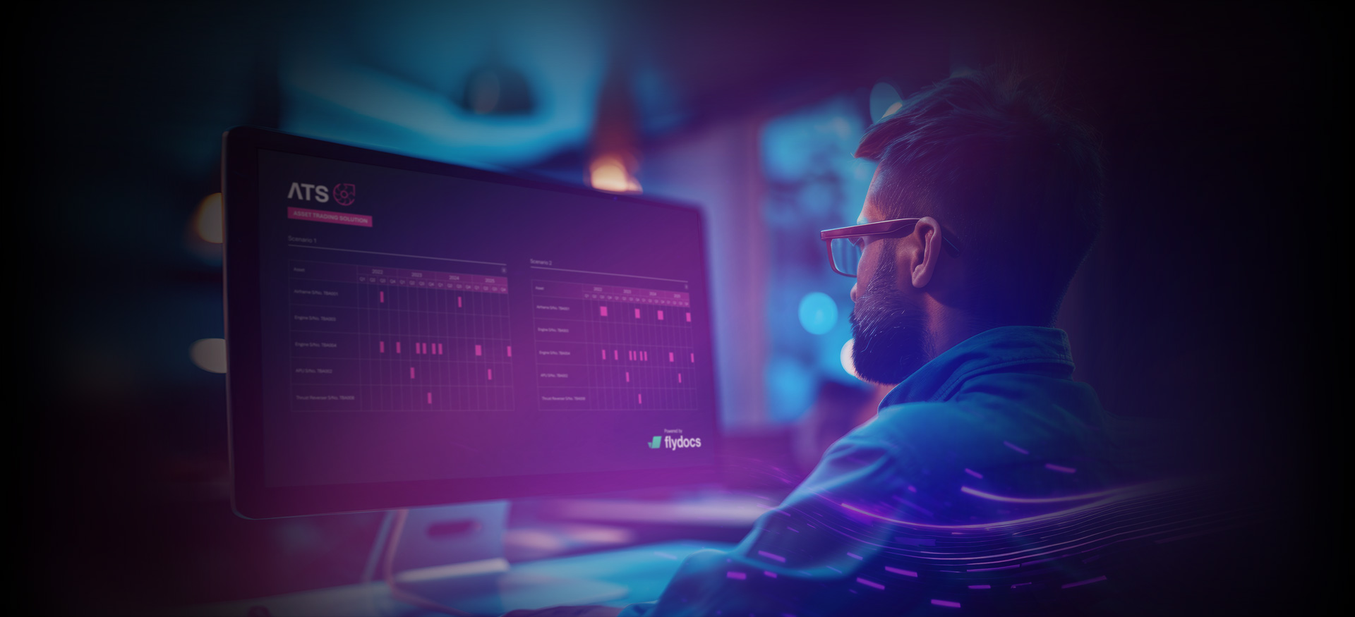 Person working at computer viewing applicant tracking system dashboard in neon-lit office