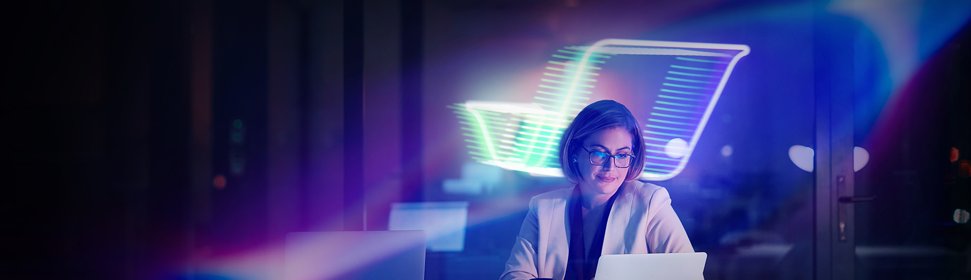 Person using laptop in modern office with flydocs logo overlay in the background