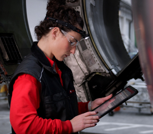 female engineer looking at tablet with information on it