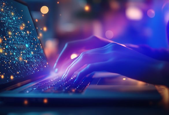 fingers typing on keyboard of laptop with image treatment